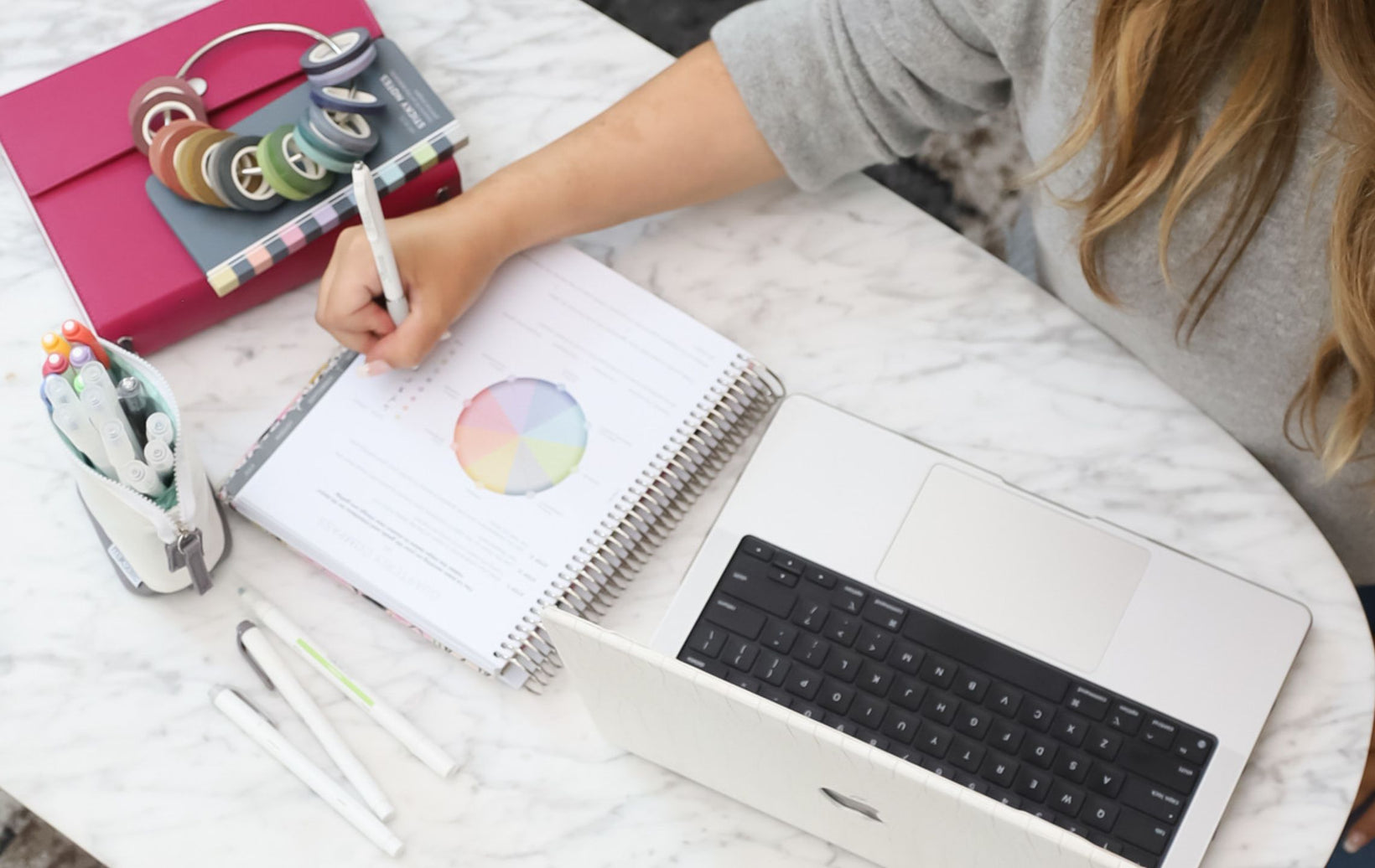 A Clubbie working through her monthly check-in in the MäksēLife planner
